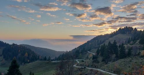 Scenic view of mountains against sky during sunset