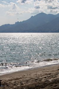 Scenic view of sea against mountains