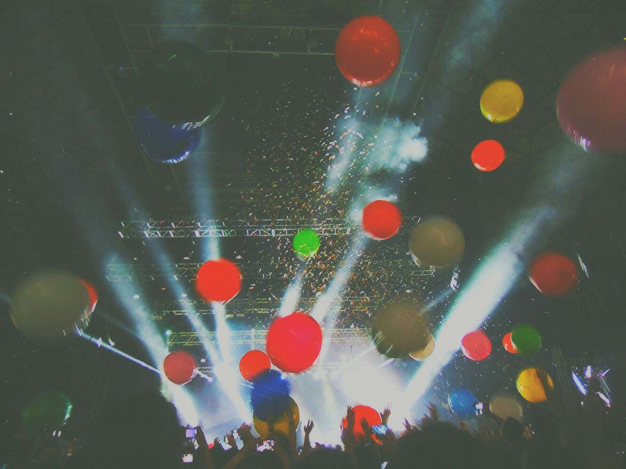 multi colored, celebration, illuminated, red, indoors, night, water, high angle view, colorful, no people, abstract, backgrounds, celebration event, motion, reflection, full frame, circle, transparent, large group of objects