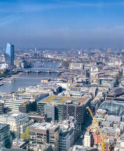 High angle view of buildings in city against sky