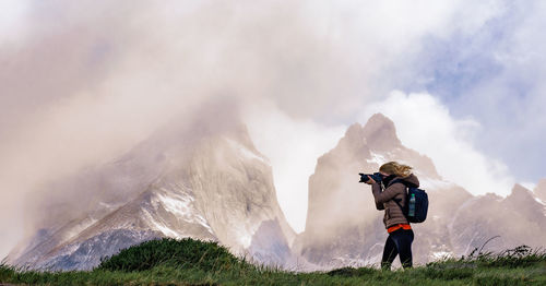 Rear view of person photographing