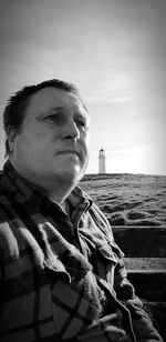 Portrait of man in sea against sky