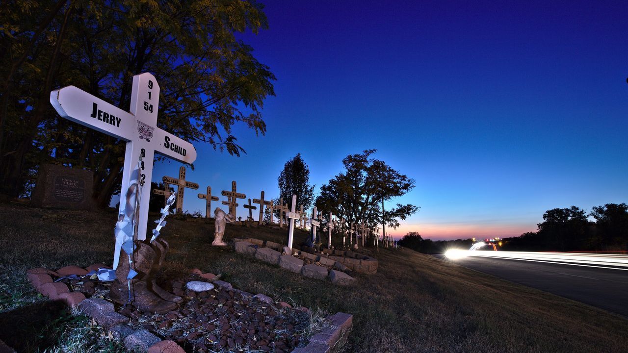 ROAD SIGN AT NIGHT