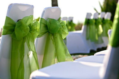 Wedding ceremony chairs with covers and bows