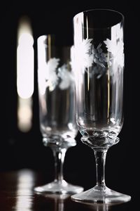 Close-up of wine glasses on table