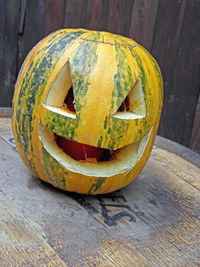 Close-up of pumpkin on wooden table