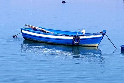 Boat moored in sea