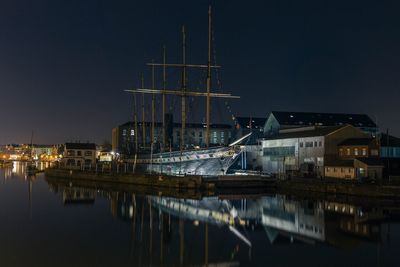 Reflection of buildings in water at night