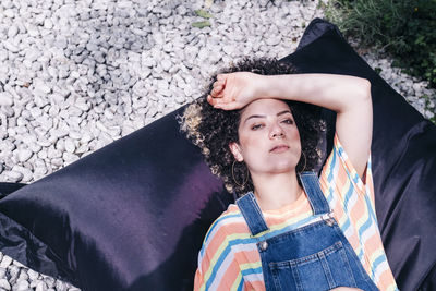 High angle portrait of woman lying on floor