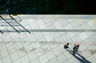 Woman standing on footpath