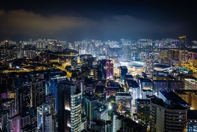 High angle view of illuminated city buildings at night