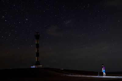 Silhouette of woman standing at night