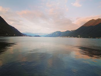 Scenic view of lake against sky during sunset