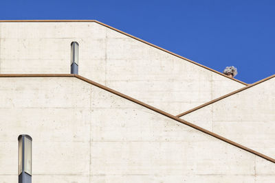 Low angle view of built structure against blue sky