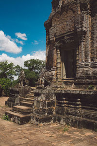 Old temple building against sky