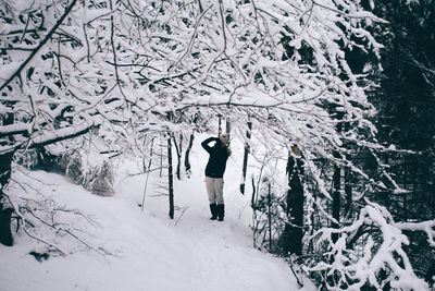 Full length of snow on tree during winter
