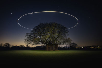 Scenic view of field against sky at night