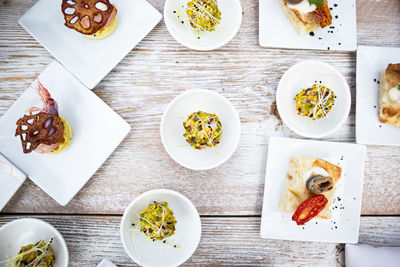 Close-up of finger food in plate on table. gourmet buffet. high angle view of food.