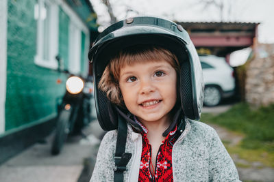 Smiling cute boy wearing helmet