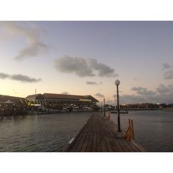 Scenic view of river against sky during sunset