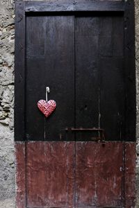 Close-up of heart shape on metal door