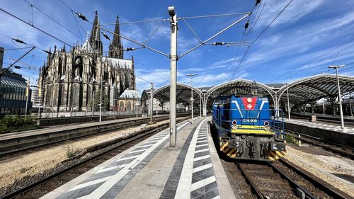 Train on railroad track against sky