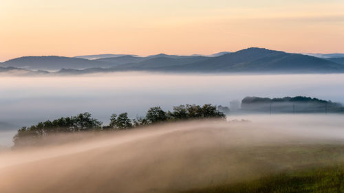 Scenic view of mountains against sky during sunset