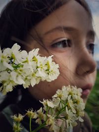 Close-up of woman holding flowers