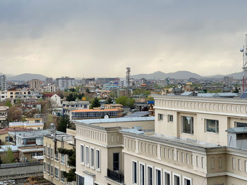 Buildings in city against sky