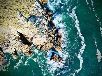 High angle view of rocks in sea