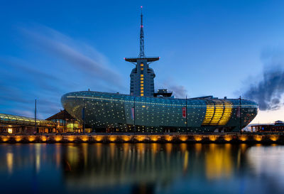 Illuminated city at waterfront