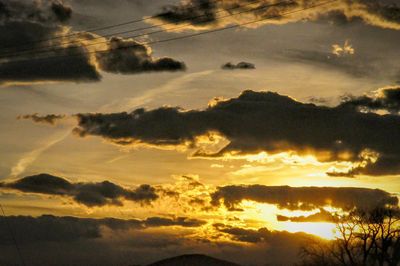 Scenic view of mountains against sky at sunset