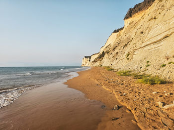 Scenic view of beach against clear sky