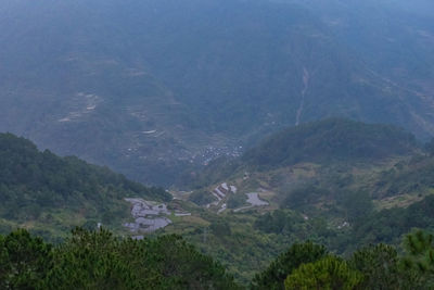 High angle view of trees and mountains against sky