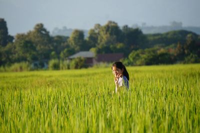 Woman standing on field