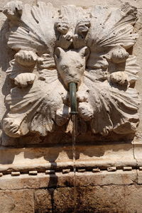 Close-up of statue against wall