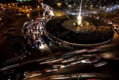High angle view of light trails on road at night