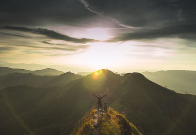 Scenic view of silhouette mountain against sky during sunset