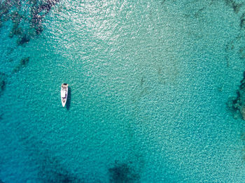 High angle view of boat sailing in sea