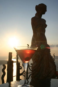 Statue against bright sun
