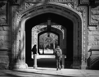 Woman in front of historical building