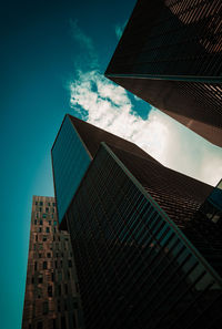 Low angle view of modern buildings against sky