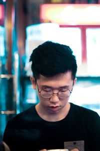 Close-up of young man wearing eyeglasses