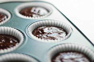 High angle view of cupcakes against white background