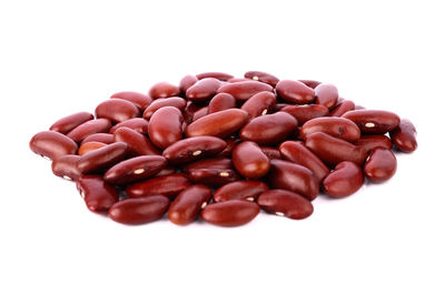 High angle view of coffee beans against white background