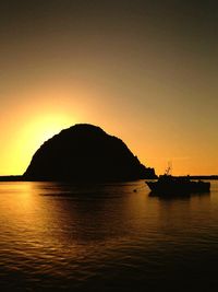 Scenic view of sea against clear sky during sunset