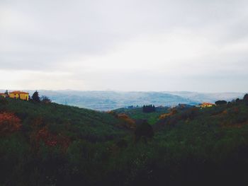 Scenic view of landscape against cloudy sky