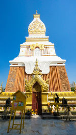 Low angle view of temple against building