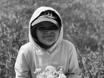 Portrait of smiling boy on field