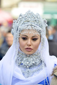 Close-up portrait of woman wearing mask